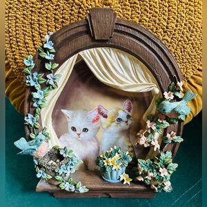 Kitty collectors adorned ceramic plate wall decor.